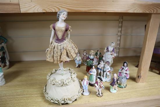 A Continental jointed porcelain figure of a ballerina on stand, a late Meissen figure of a dancer and ten other figures, tallest 32.5cm